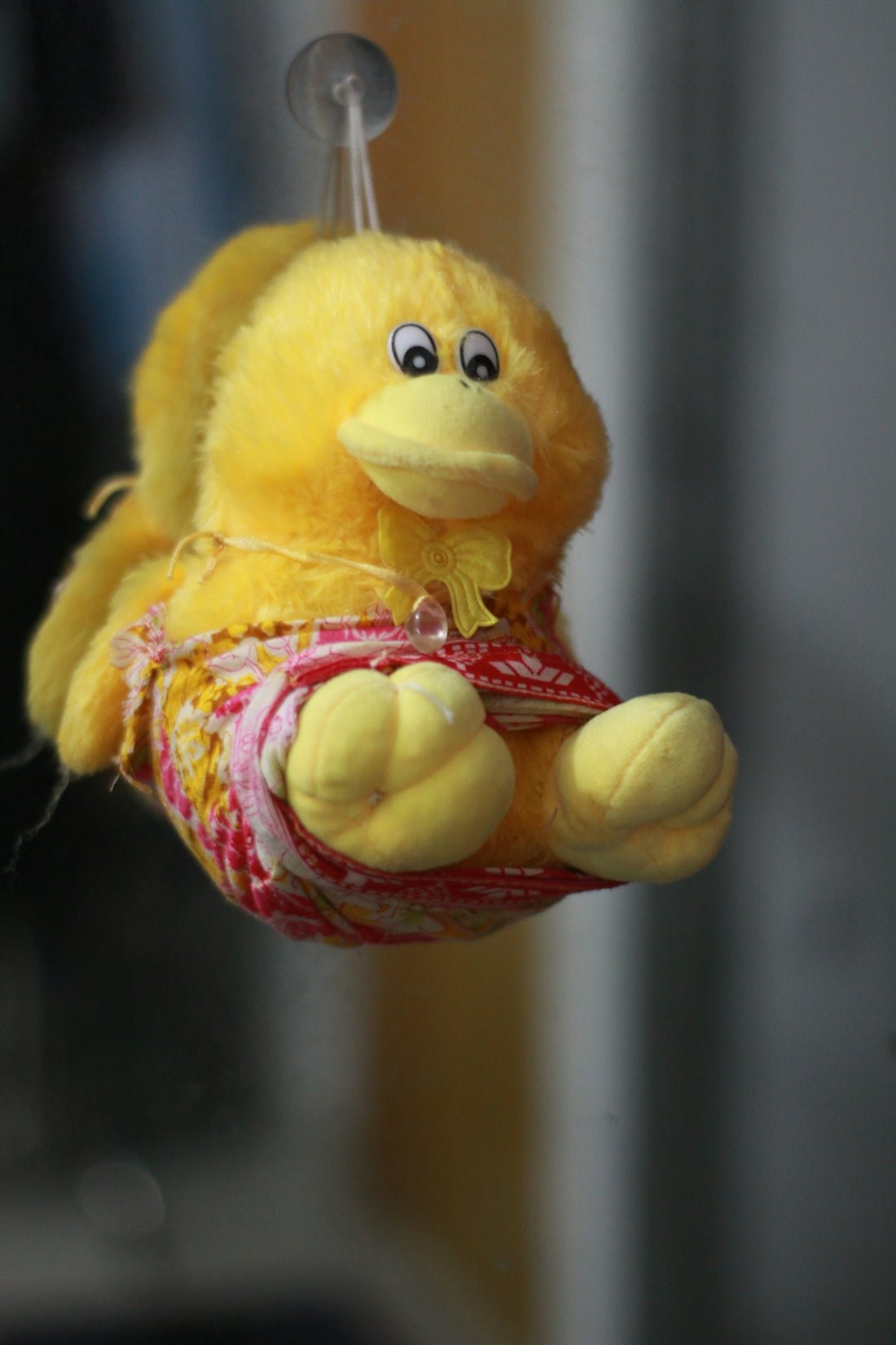 yellow and red duck plush toy
