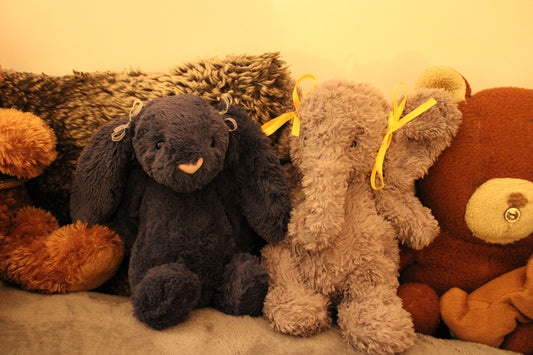 a group of stuffed animals sitting next to each other