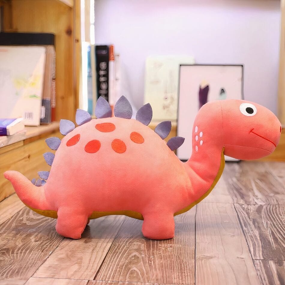 Grappige Roze Dinosaurus Knuffel met Grote Ogen en Glimlach De Knuffel