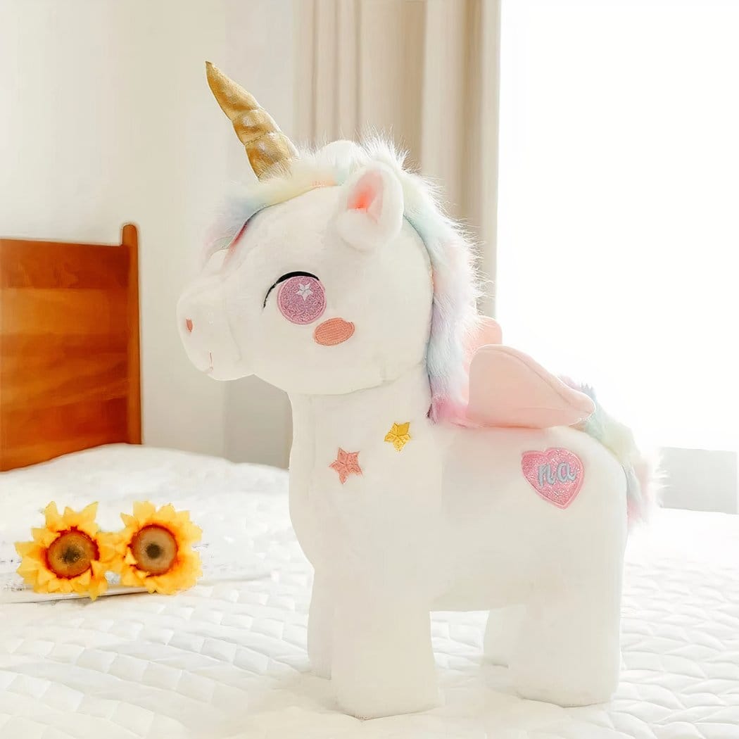 Schattige Eenhoornknuffel Met Gouden Hoorn En Regenboogvleugels De Knuffel roze