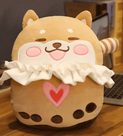 Schattige Shiba-achtige Knuffel Met Zijdeachtige Vacht En Glimlach De Knuffel